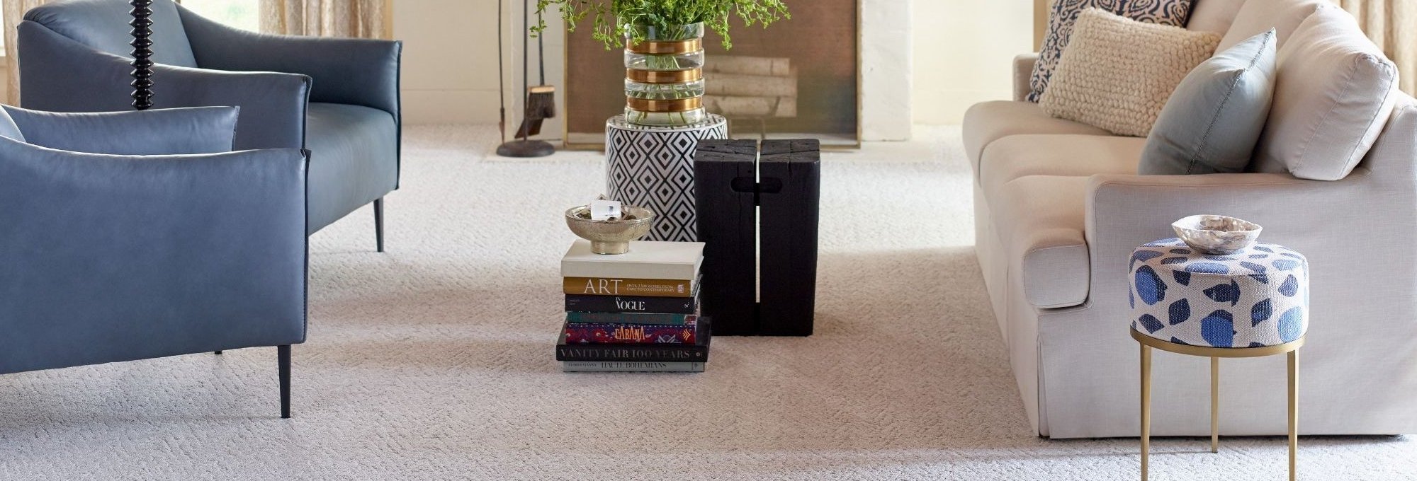 living room with a blue couch and a gray couch with beige carpet from New Horizon Carpets in the Hemet, CA area