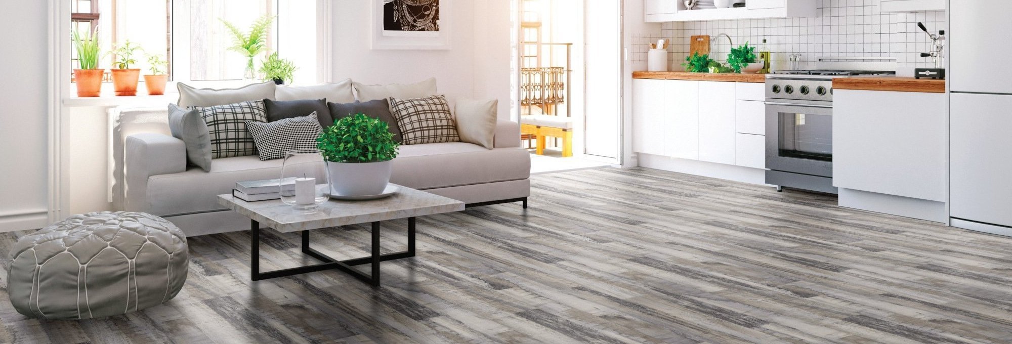 Living room with gray wood-look laminate flooring from New Horizon Carpets in the Hemet, CA area